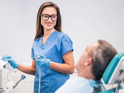 Healthcare worker helping old man