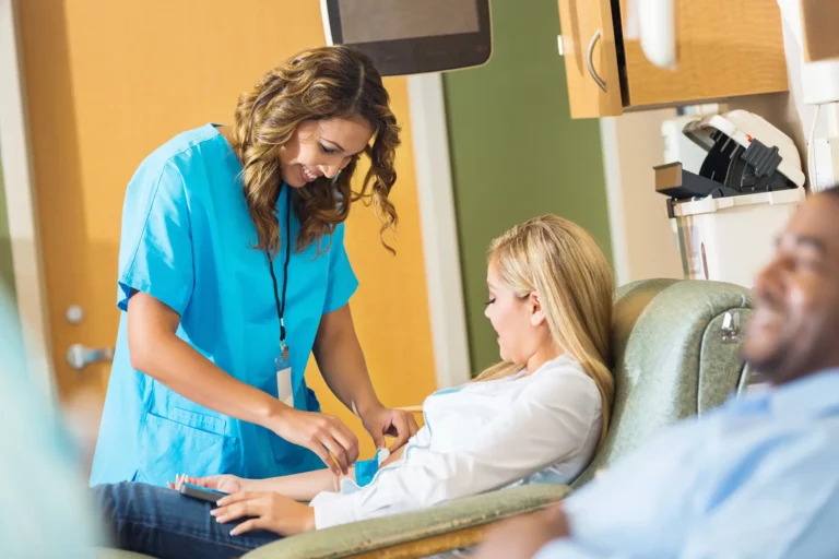 female healthcare worker taking care of female patient